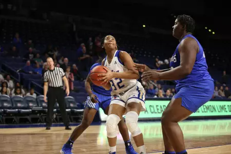 Desiree Lewis playing basketball