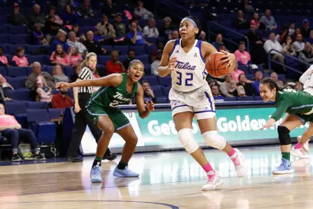 Desiree Lewis playing basketball