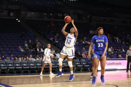 Desiree Lewis playing basketball