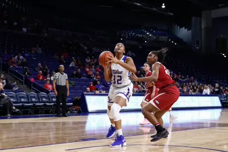 Desiree Lewis playing basketball