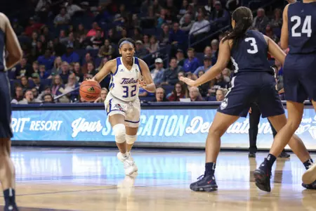 Desiree Lewis playing basketball