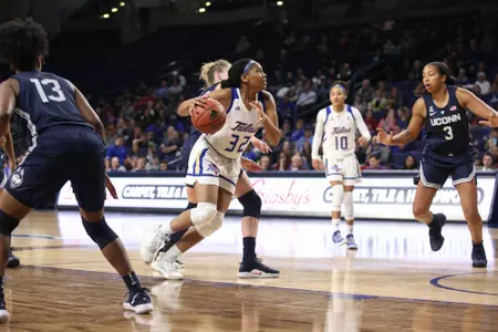 Desiree Lewis playing basketball