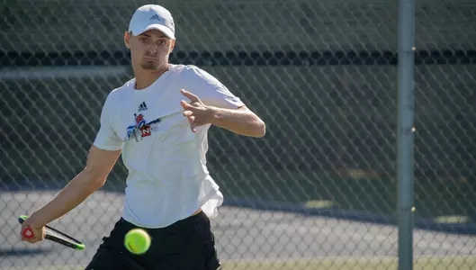 Kody Pearson serving at Oracle ITA National Fall Championships