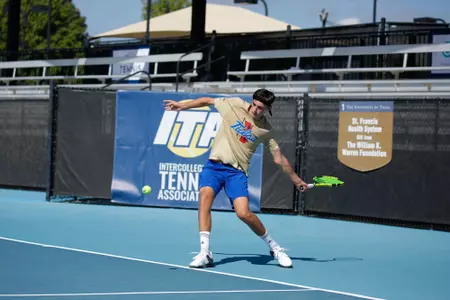 men's tennis player swinging a racket