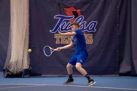 men's tennis player swinging a racket