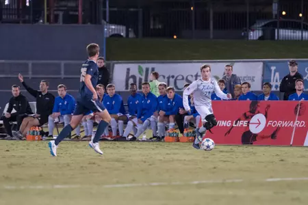 Mitchell Cashion kicking a soccer ball