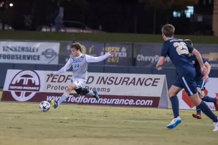 Mitchell Cashion kicking a soccer ball