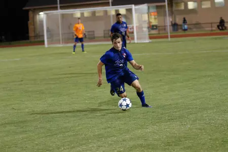 Mitchell Cashion kicking a soccer ball