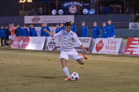 Alejandro Chavez kicking a soccer ball