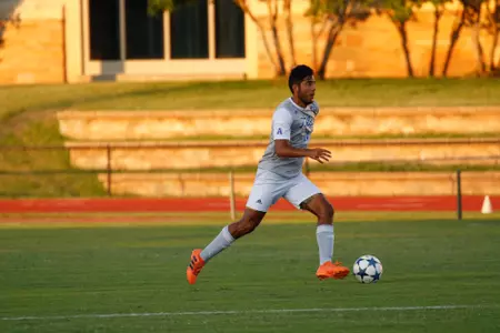 Alejandro Chavez kicking a soccer ball