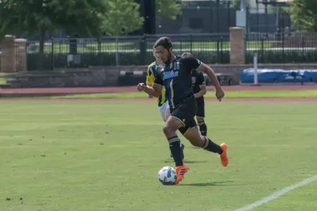 Alejandro Chavez kicking a soccer ball