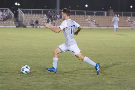 Adam Habib kicking a soccer ball