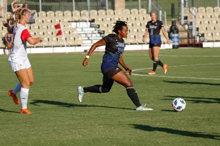Jada Holmes playing soccer