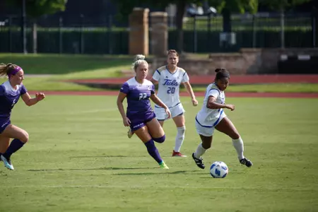 Neha Igwe playing soccer