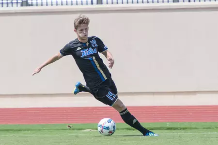 Harris Partain kicking a soccer ball