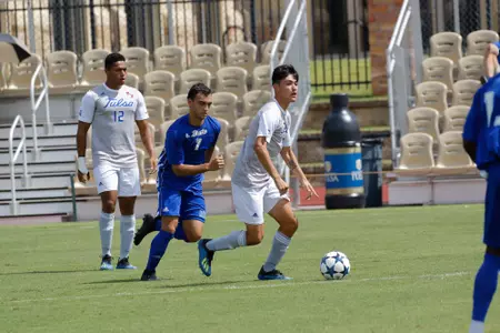 Joe Ruiz kicking a soccer ball