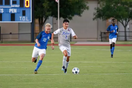 Joe Ruiz kicking a soccer ball