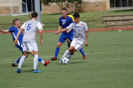 Joe Ruiz kicking a soccer ball