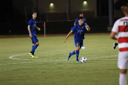 Joe Ruiz kicking a soccer ball