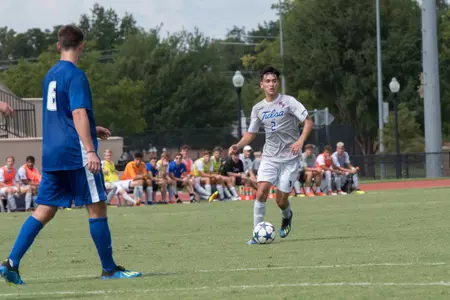 Joe Ruiz kicking a soccer ball