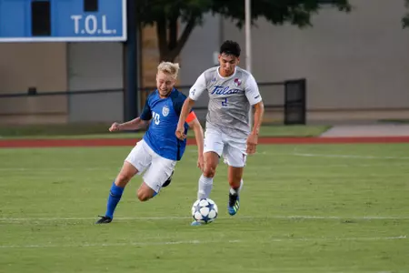 Joe Ruiz kicking a soccer ball