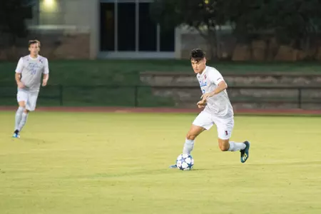 Joe Ruiz kicking a soccer ball