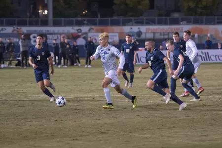 Joe Ruiz kicking a soccer ball