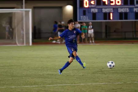 Joe Ruiz kicking a soccer ball