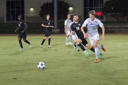 Austen Schweinert kicking a soccer ball