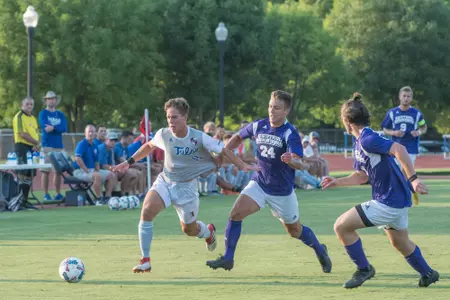 Thomas Wells kicking a soccer ball