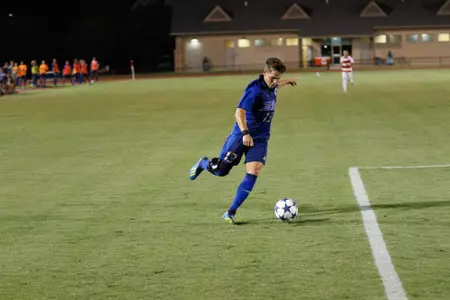 Thomas Wells kicking a soccer ball