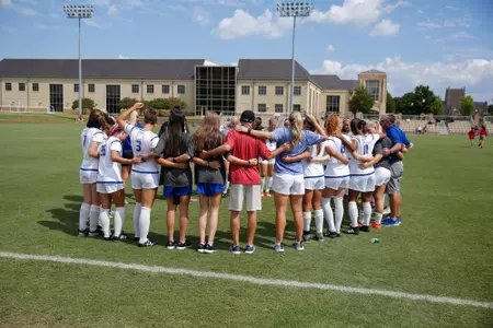 women's soccer team huddle