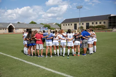 women's soccer team huddle