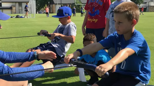 Youth on the rowing ergs at Tulsa Plays