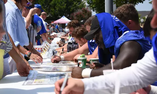 Players signing autographs