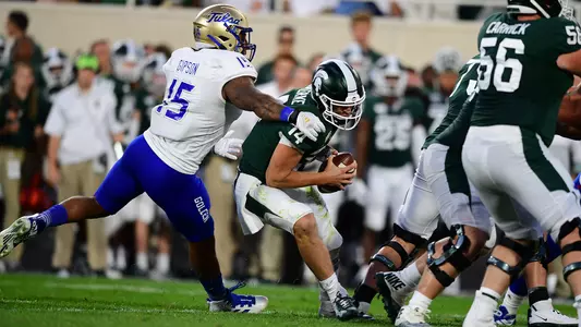 Trevis Gipson sacks the Michigan State quarterback