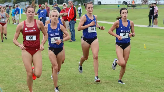 Carolina Miller, Adrena Mazzei and Caitlin Klopfer run at the Hurricane Preview