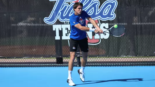 Juan Pablo Cenoz hits tennis ball at Poster Day