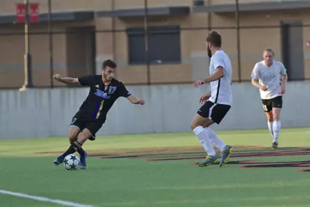 Adam Habib playing soccer