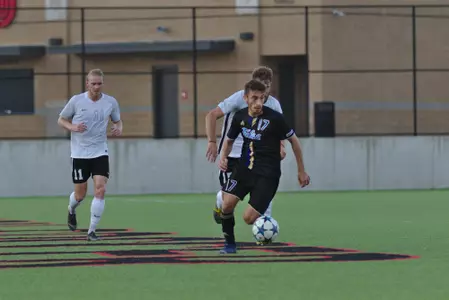 Adam Habib playing soccer