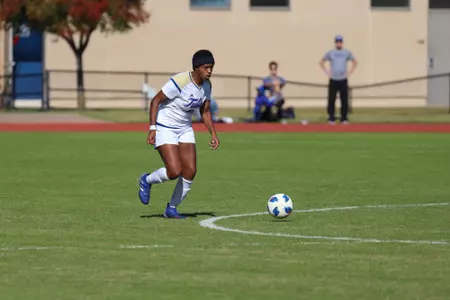 Jada Holmes playing soccer