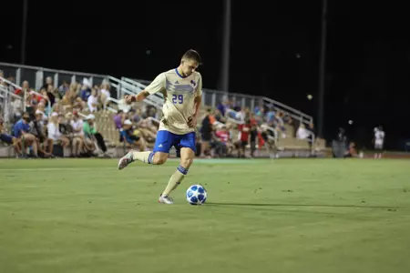 Austen Schweinert playing soccer