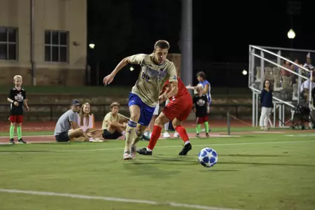 Austen Schweinert playing soccer