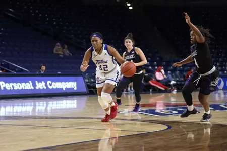 Desiree Lewis playing basketball