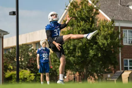 Lachlan Wilson punting