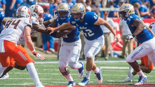 Adam Higuera runs down field