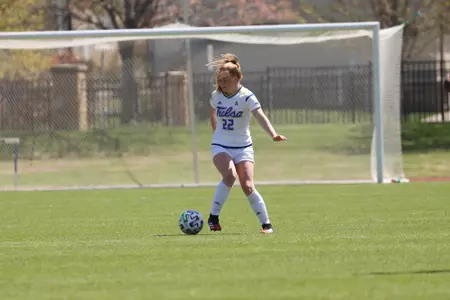 Gabrielle Armstrong playing soccer
