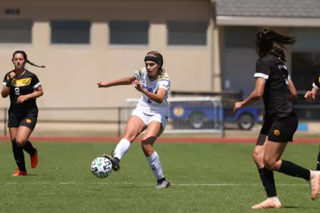 Madison Moss playing soccer