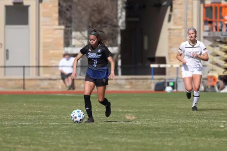 Emilie Torres playing soccer