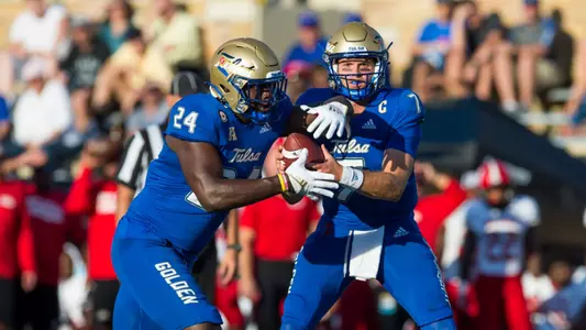 Tulsa Golden Hurricane quarterback Davis Brin (7) and Tulsa Golden Hurricane running back Steven Anderson (24) BRETT ROJO/For the University of Tulsa